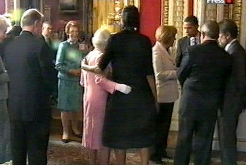 queen touches Michelle Obama
